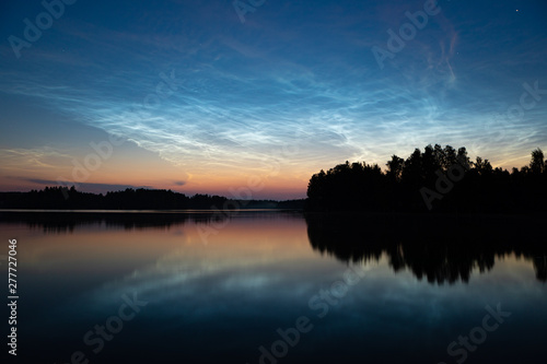 Night shining clouds over lake © Juhku