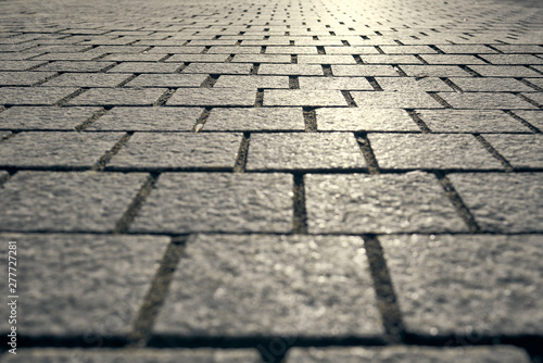 Abstract background - gray paving slabs in the form of squares.