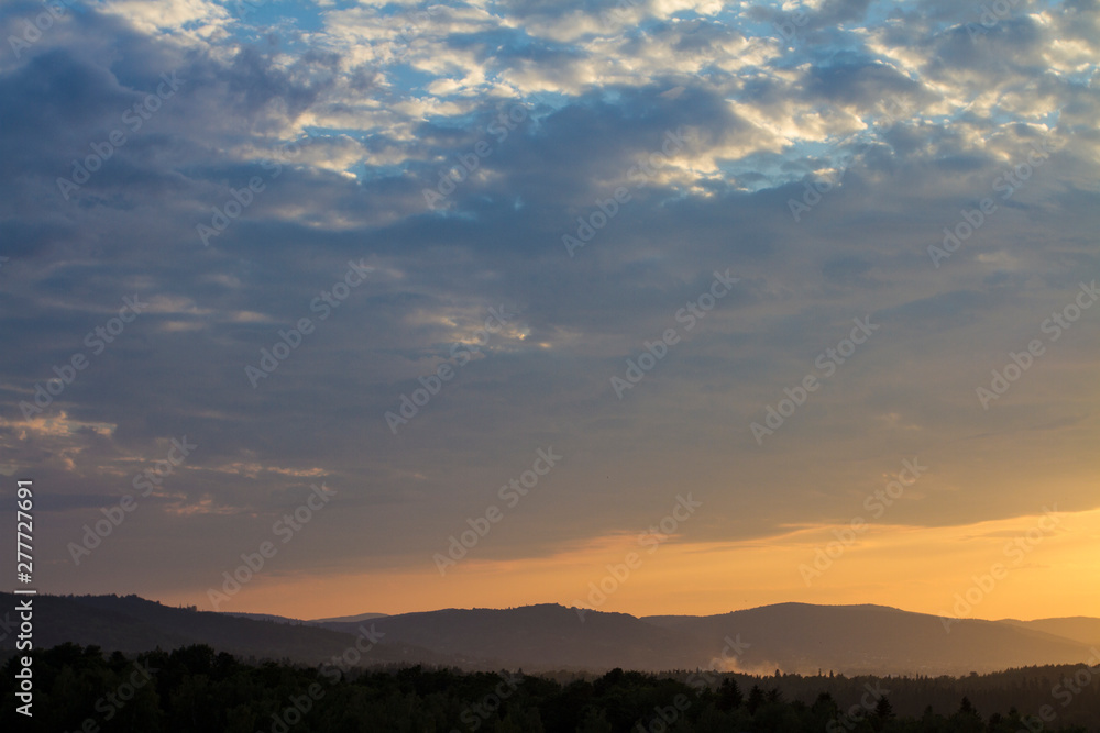 Dramatic sunny hills under morning sky. Carpathian, Ukraine, 