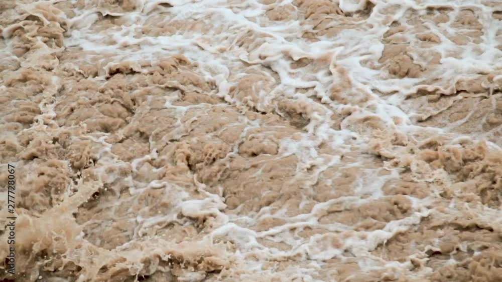 The flow of dirty water after the flood. The flow of dirty water after the flood.