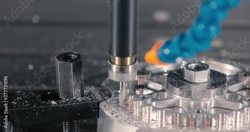 Automated programmable metal processing machine. Industrial robot arm with gauges. Metalworking Exhibition.