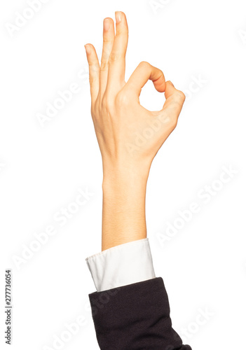 Businesswoman's counting hand with zero gesture on white