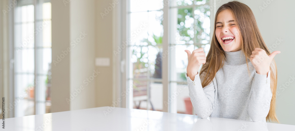 Wide angle picture of beautiful young girl kid wearing casual sweater success sign doing positive gesture with hand, thumbs up smiling and happy. Looking at the camera with cheerful expression, Wide angle picture of beautiful young girl kid wearing casual sweater success sign doing positive gesture with hand, thumbs up smiling and happy. Looking at the camera with cheerful expression,