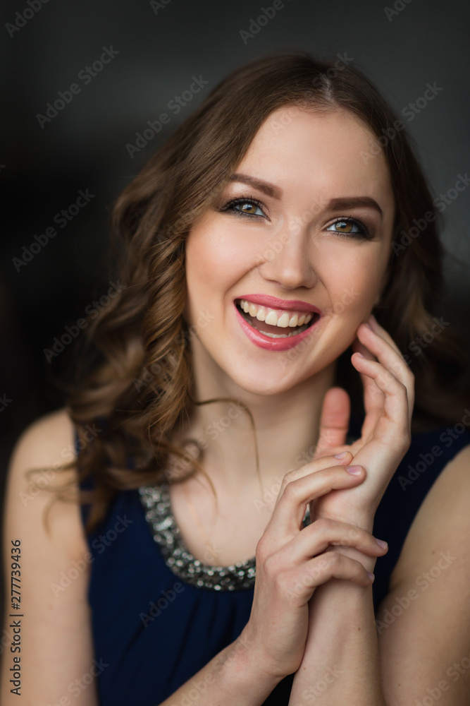 Closeup portrait of attractive young woman smiling