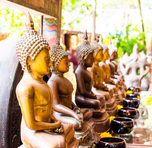 Golden Buddha statues in the courtyard of the temple Gangaramaya  Colombo  Sri Lanka. With selective focus.