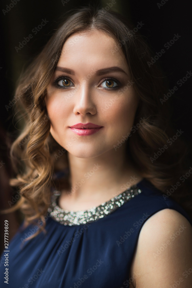 Closeup portrait of attractive young woman smiling Closeup portrait of attractive young woman smiling