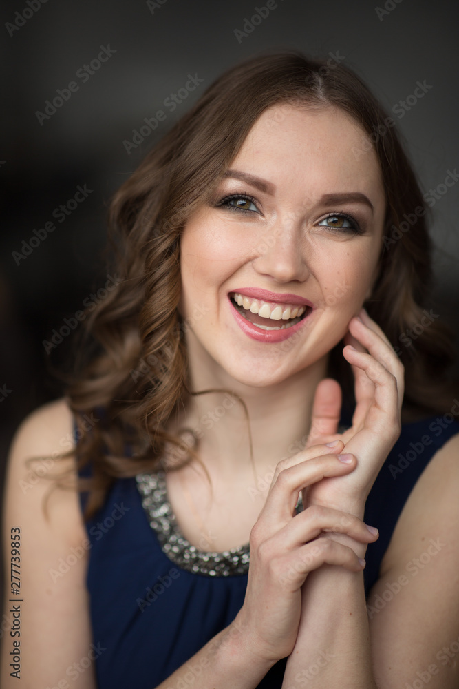 Closeup portrait of attractive young woman smiling Closeup portrait of attractive young woman smiling