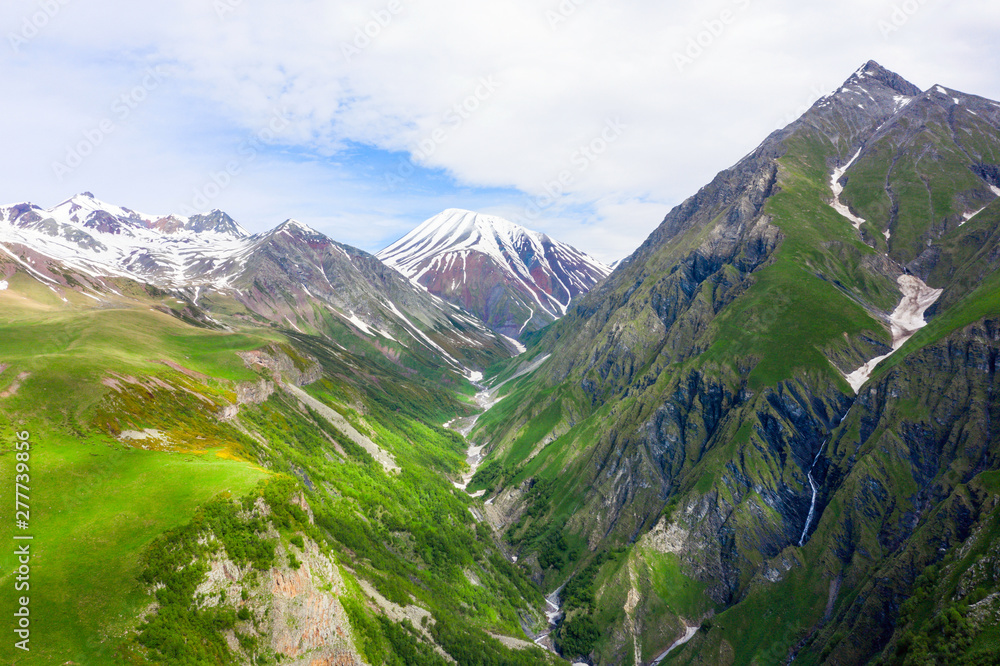 Caucasus mountains. Georgian Military Road. Kudskoe or Gudskoe gorge and extinct Sherkhot volcano on the Kelsk volcanic plateau. Jvari pass near the ski resort Gudauri.