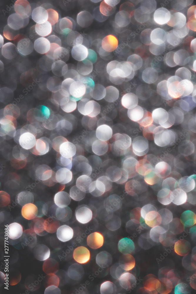 Obraz premium Multicolored defocused shiny confetti.