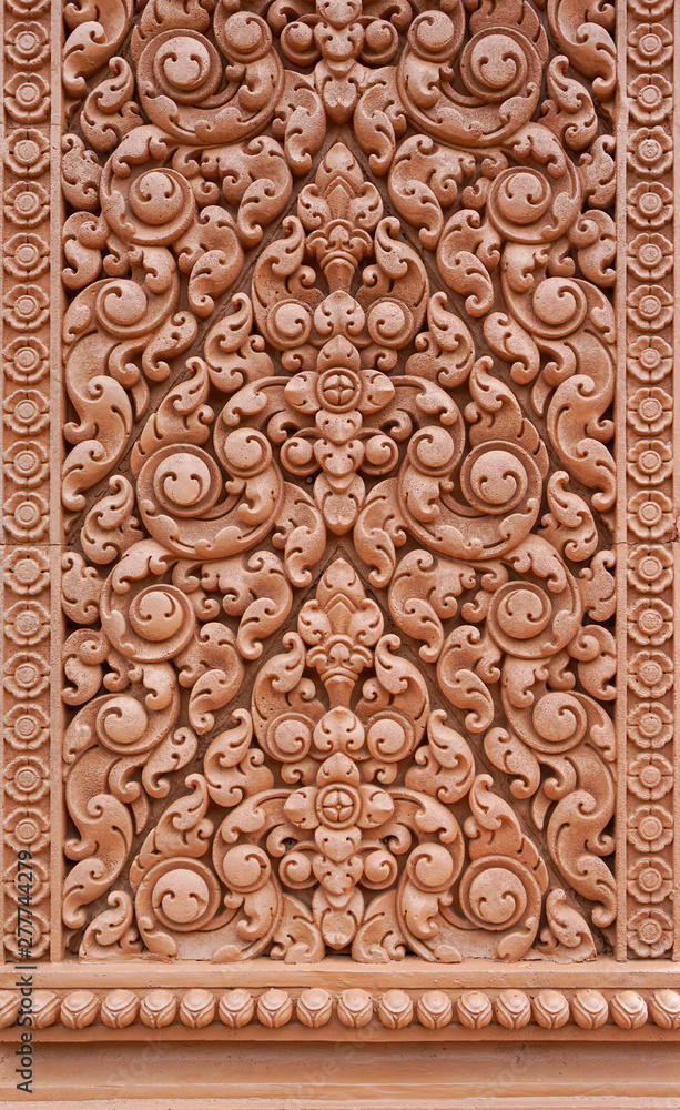 Obraz premium Wat Tham Phu Wa, Kanchanaburi, Thailand , May 12 2016 : Low relief sculpture, Thai pattern, wall mounted