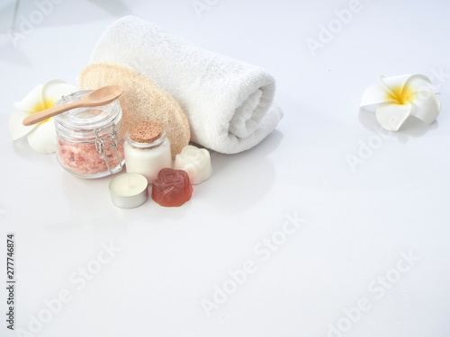 Set of spa accessories on a white table