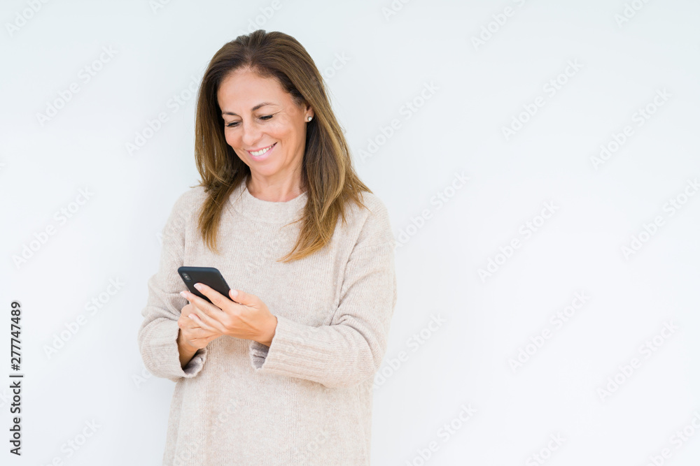 Middle age woman using smartphone over isolated background with a happy face standing and smiling with a confident smile showing teeth Middle age woman using smartphone over isolated background with a happy face standing and smiling with a confident smile showing teeth