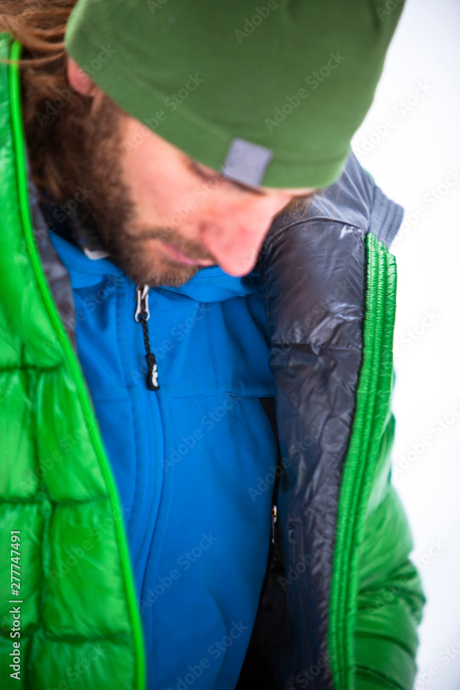 A man gets ready to climb The Good Looking One at Hyalite Canyon in Montana. A man gets ready to climb The Good Looking One at Hyalite Canyon in Montana.