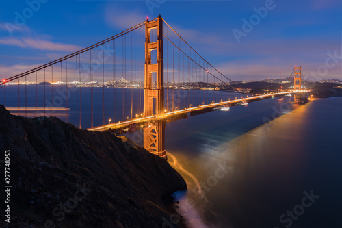 Fototapeta Naklejka Na Ścianę i Meble -  Classic panoramic view of famous Golden Gate Bridge in beautiful evening light on a dusk with blue sky and clouds in summer or autumn, San Francisco, California, USA