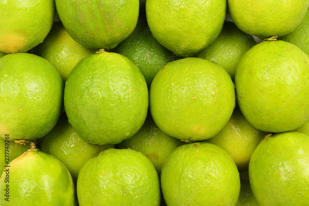 Many fresh limes on white background. Many fresh limes on white background.