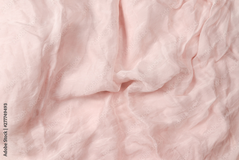 Soft smooth pink silk fabric background. Fabric texture. Soft smooth pink silk fabric background. Fabric texture.