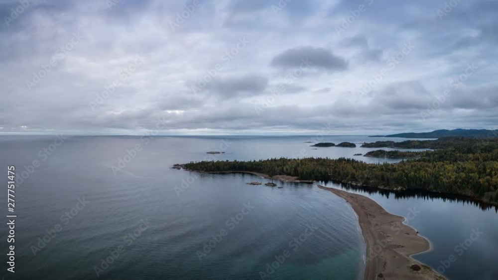 Aerial view of a beautiful beach on the Lake Superior during a vibrant cloudy sunrise. Taken in Terrace Bay, Ontario, Canada. Still Image Continuous Animation Aerial view of a beautiful beach on the Lake Superior during a vibrant cloudy sunrise. Taken in Terrace Bay, Ontario, Canada. Still Image Continuous Animation