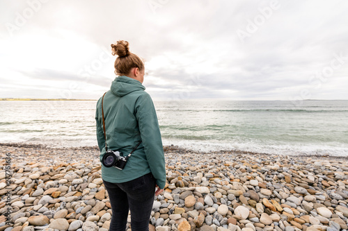 Strandhill, Sligo, Ireland: A woman looking out over the ocean. photo