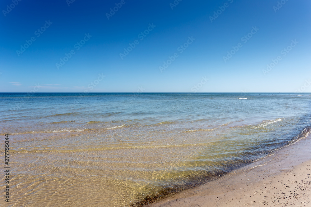 Beautiful beach and waves of Baltic Sea in summer in Poland