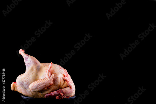 raw turkey carcass on black background for menu