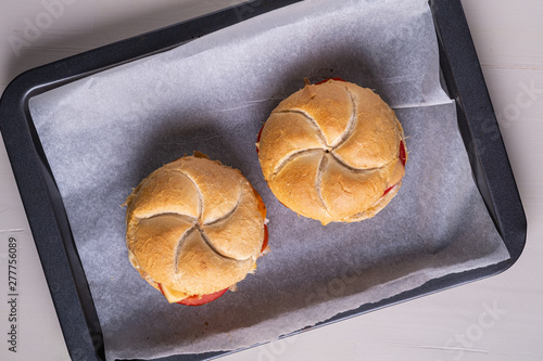 Canvas Print Two homemade burger Vienna Kaiser bread bun bread roll with chicken meat tomato