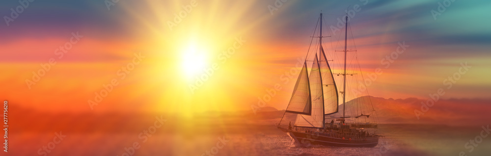 Old ancient ship on peaceful ocean at sunset. Calm waves reflection, sun setting. Copy space. Panoramic view
