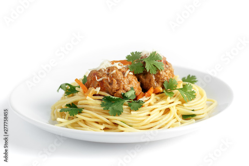 meatballs with pasta on a white plate on a white isolated background. Delicious Meat Balls Decorated with Herbs