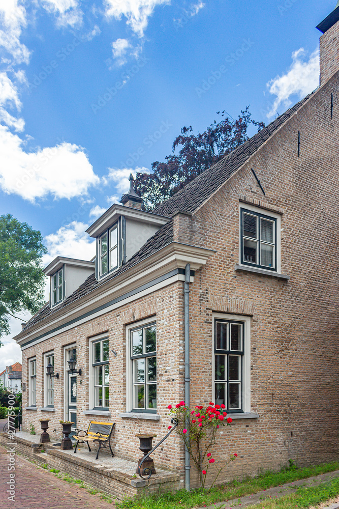 Historic buildings on the Herengracht in the picturesque village Drimmelen, Netherlands