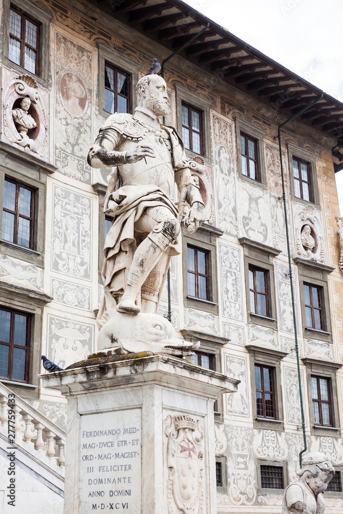 The statue of Cosimo I de Medici in front of Palazzo della Carovana built in 1564 located at the palace in Knights Square in Pisa