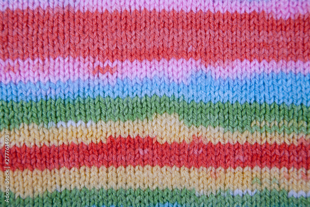 Multi color - orange, white, blue, grey, green. Striped Fabric Knit Cloth Texture. Abstract Close up Line Pattern Background
