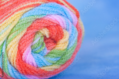 Multicolored thick yarn. Textile manufactory, interior items. Needlework, hobby, handicraft, knitting