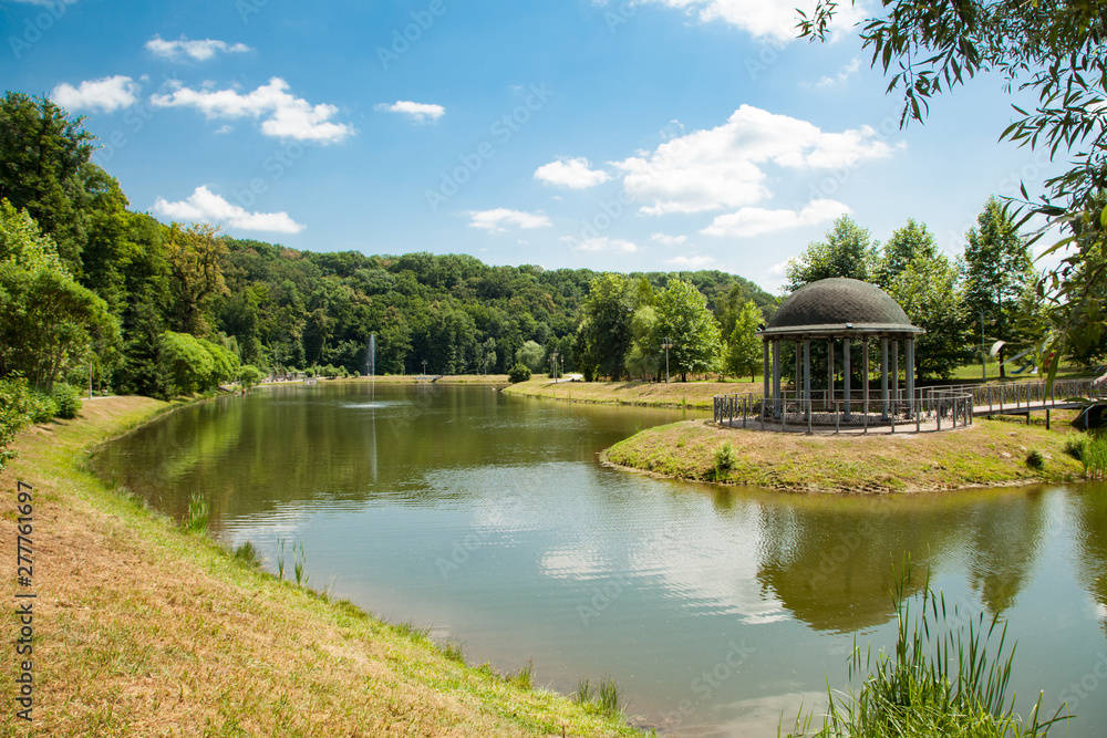 Feofania is the youngest garden in Kiev, an excellent example of landscape architecture. Pond in summer sunny day Feofania is the youngest garden in Kiev, an excellent example of landscape architecture. Pond in summer sunny day