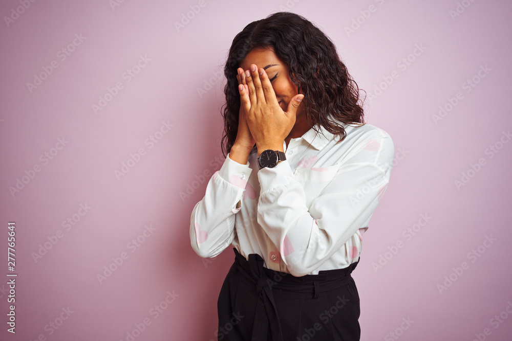 Transsexual transgender businesswoman standing over isolated pink background with sad expression covering face with hands while crying. Depression concept. Transsexual transgender businesswoman standing over isolated pink background with sad expression covering face with hands while crying. Depression concept.