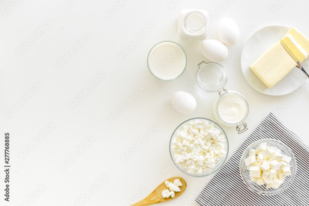 Breakfast on farm with dairy products on white background top view space for text Breakfast on farm with dairy products on white background top view space for text