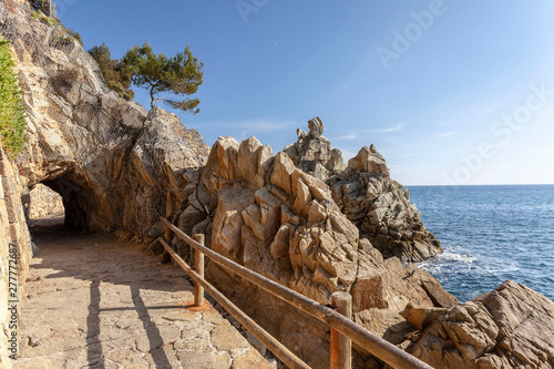 Stone footpath in Fenals beach, Lloret de Mar, Costa Brava, Catalonia, Spain. photo