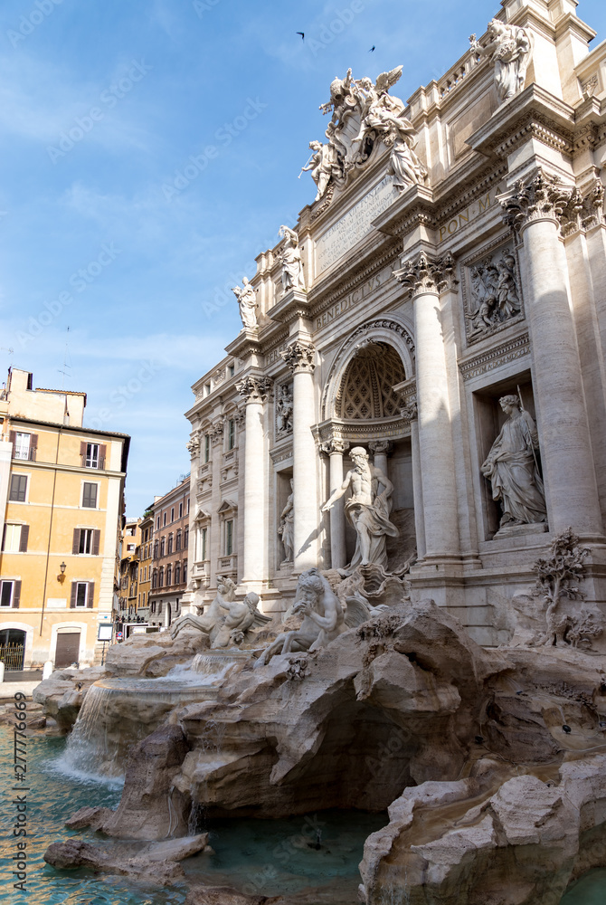 Trevi Fountain (Fontana di Trevi) in the early morning, famous fountain in the Trevi district of Rome - Italy.