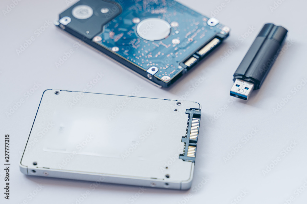 SSD drive, USB Pendrive and 2.5 HDD drive. Solid State Drive vs traditional HDD, isolated. Fast storage device vs slow. SSD drive, USB Pendrive and 2.5 HDD drive. Solid State Drive vs traditional HDD, isolated. Fast storage device vs slow.