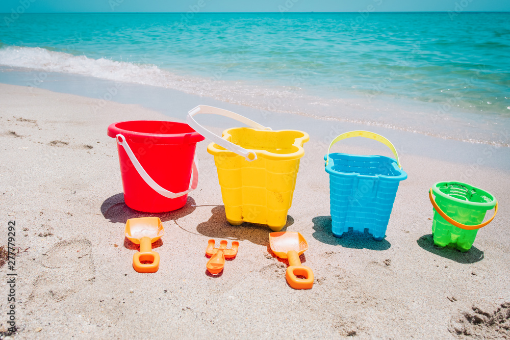 kid toys on tropical sand beach, family vacation kid toys on tropical sand beach, family vacation