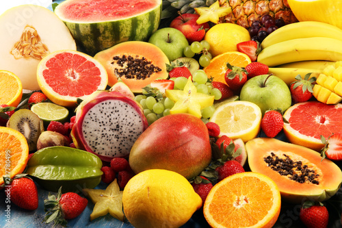 Tropical fruits background  many colorful ripe fresh tropical fruits