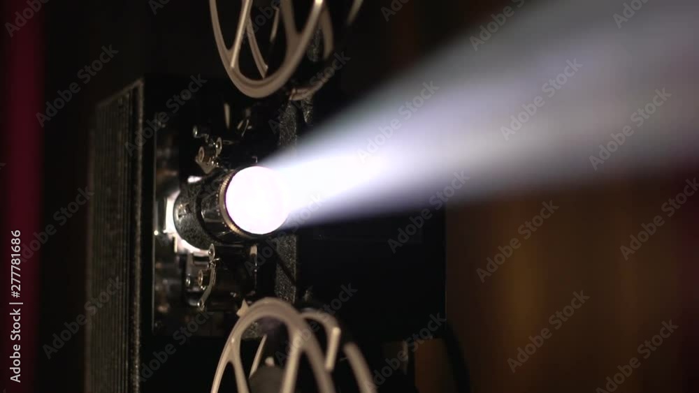 Close up of a vintage movie projector, turning
