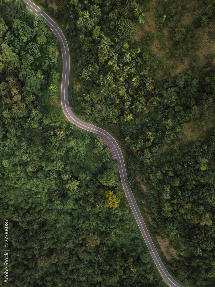 Aerial view of a road in mountains, West Sumbawa, Indonesia Aerial view of a road in mountains, West Sumbawa, Indonesia