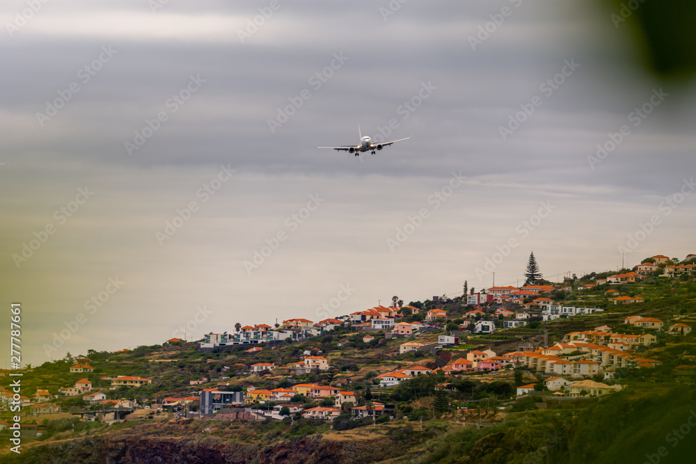 Plane approaching landing on Madeira airport, Portugal Plane approaching landing on Madeira airport, Portugal