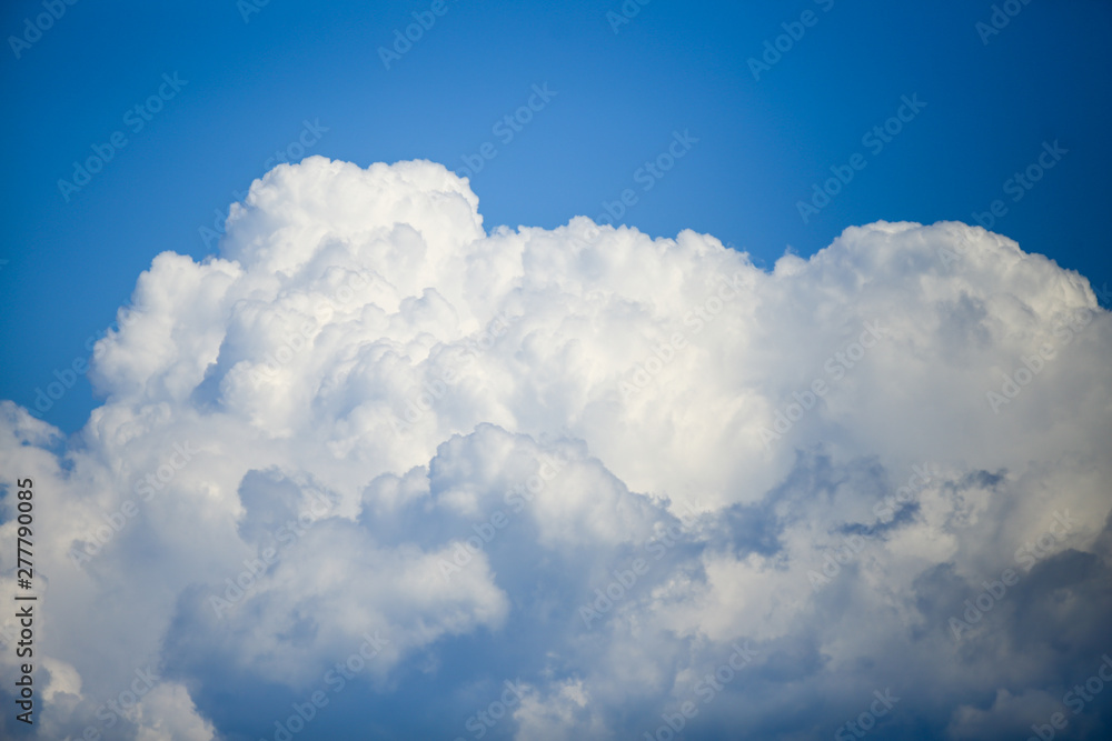 Details with white Cumulonimbus clouds on a clear blue sky on a sunny summer day Details with white Cumulonimbus clouds on a clear blue sky on a sunny summer day