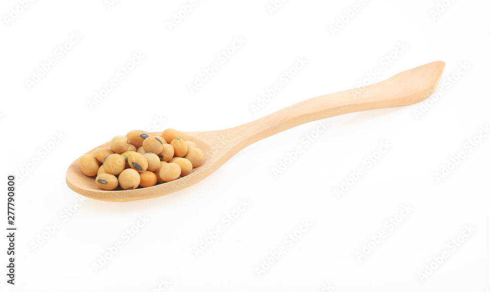 Soy beans in spoon on white background Soy beans in spoon on white background