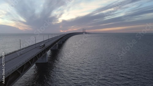 Wallpaper Mural Aerial view of Øresund Bridge at dusk. Drone shot flying over sea and bridge, driving truck and cars at sunset. Connection between Malmö, Sweden and Copenhagen, Denmark Torontodigital.ca
