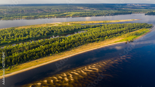  Aerial view from the drone of landscape Volga river flows among the hills and fields. The middle band of Russia.
