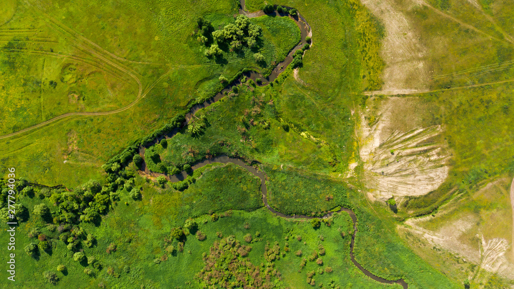 Aerial view from the drone of summer landscape with river, hills and forests. Aerial view from the drone of summer landscape with river, hills and forests.