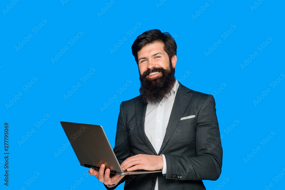 Happy bearded man with laptop. Smiling business expert with pc. Businessman works with notebook at office. Businessman with computer. Bearded businessman hold laptop. Handsome businessman hold laptop. Happy bearded man with laptop. Smiling business expert with pc. Businessman works with notebook at office. Businessman with computer. Bearded businessman hold laptop. Handsome businessman hold laptop.