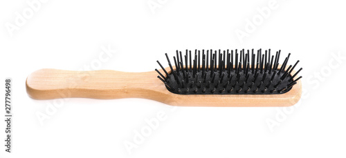 New wooden hair brush on white background