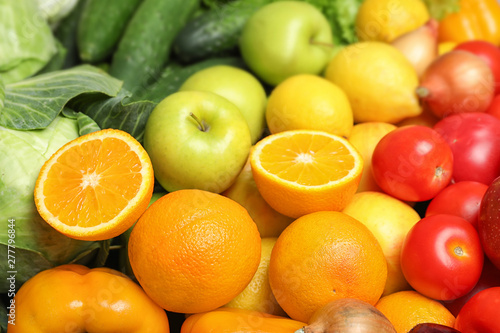 Colorful ripe fruits and vegetables as background, closeup